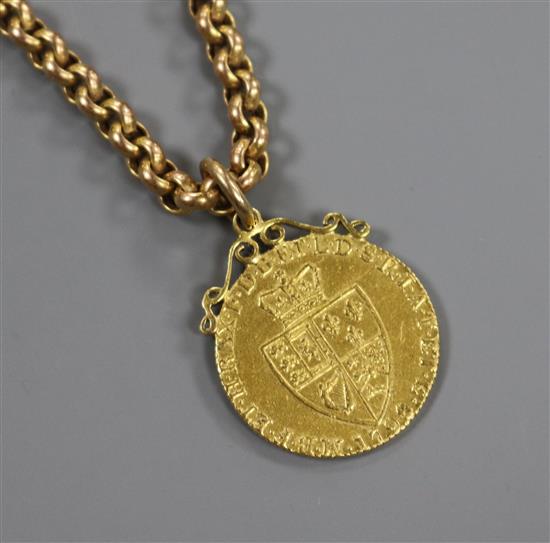 A 9ct gold chain link necklace with a George III 1798 gold spade guinea mounted as a pendant, gross 33.3 grams.